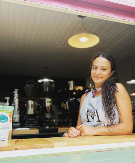 Hamilton Mercantile Coffee Shop Window with smiling employee